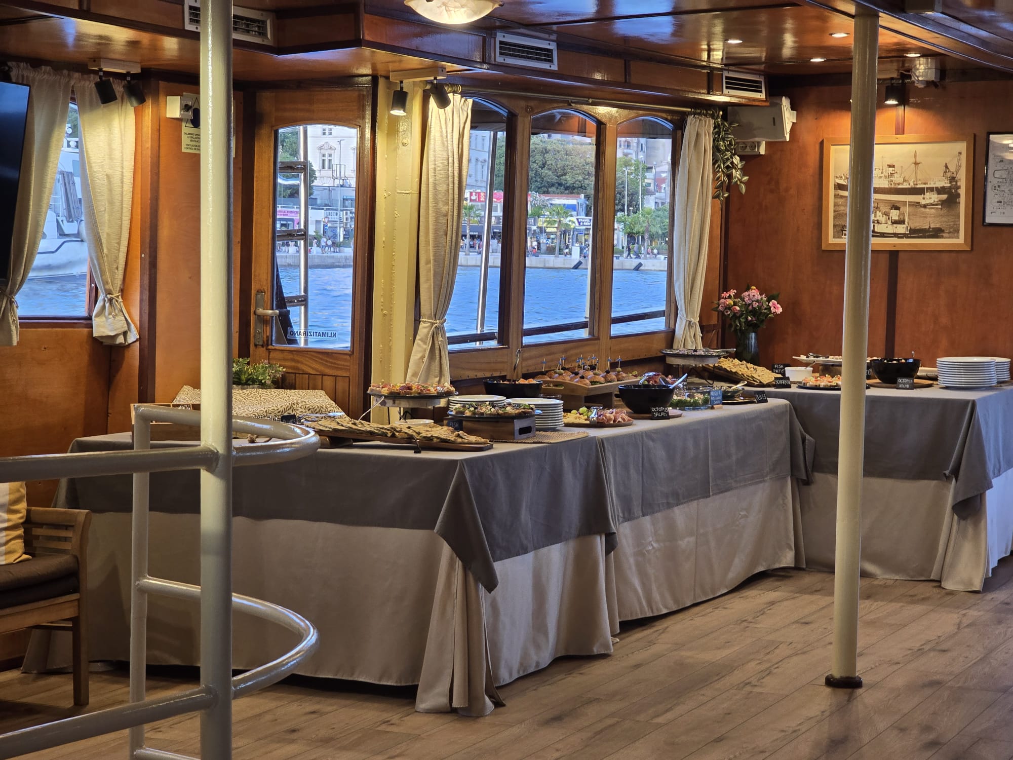 The Polaris dining lounge with the buffet set along windows overlooking the harbor